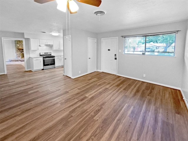 712 Brookfield Dr, Hurst, TX 76053 - unfurnished living room featuring baseboards, ceiling fan, and wood finished floors