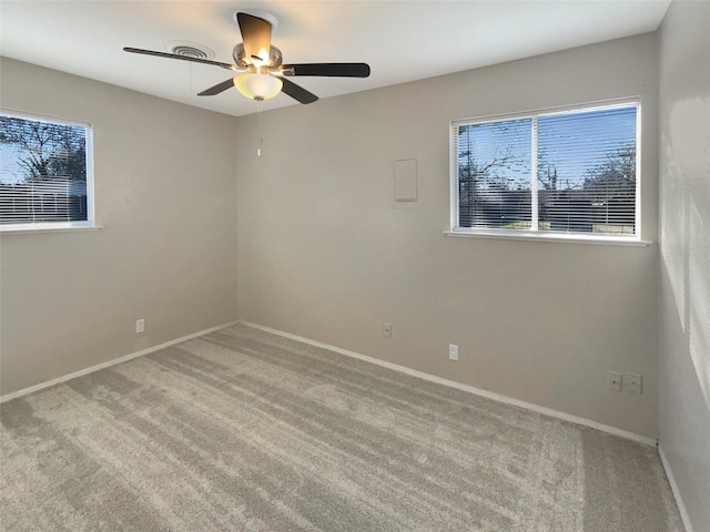 carpeted empty room featuring ceiling fan