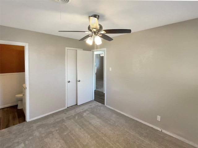 712 Brookfield Dr, Hurst, TX 76053 - unfurnished bedroom featuring a closet, carpet floors, baseboards, and connected bathroom