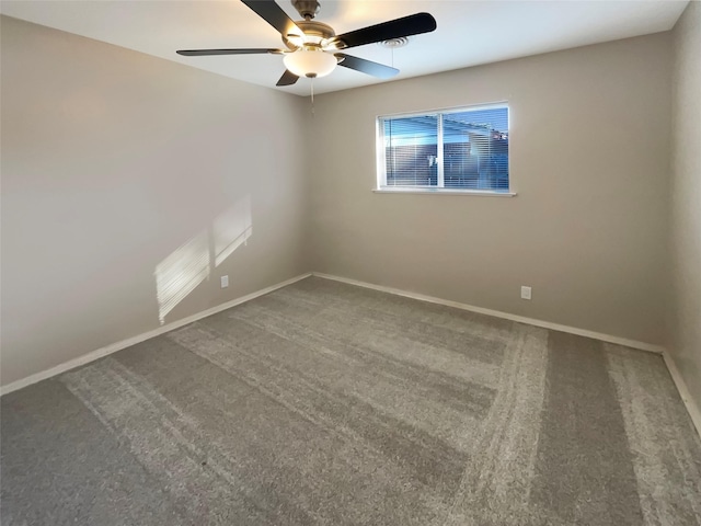 unfurnished room with ceiling fan and carpet floors