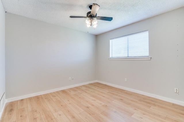 unfurnished room featuring ceiling fan, light hardwood / wood-style floors, and a textured ceiling