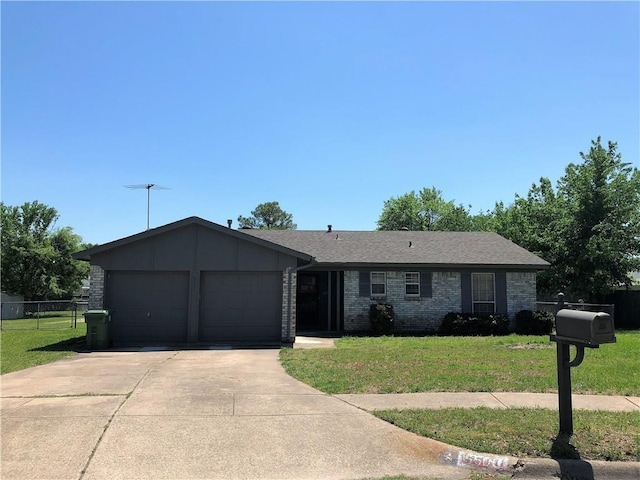 ranch-style house featuring brick siding, an attached garage, fence, driveway, and a front lawn