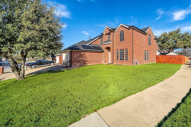 view of side of property featuring a lawn