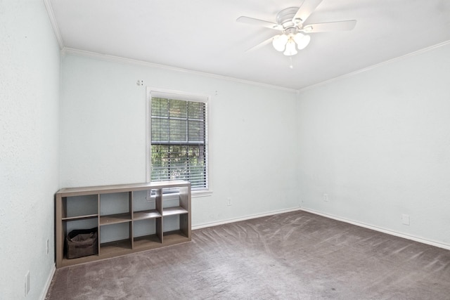 carpeted empty room featuring ceiling fan and ornamental molding