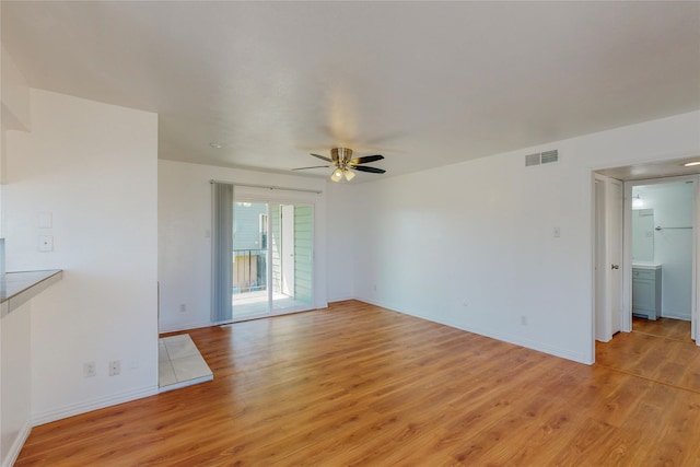 unfurnished living room with ceiling fan and light hardwood / wood-style floors