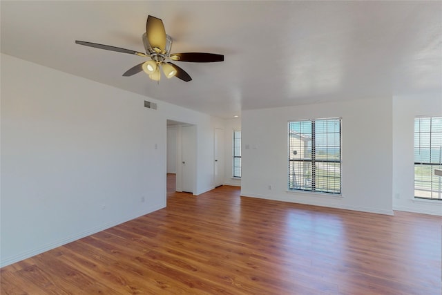 unfurnished living room with ceiling fan and hardwood / wood-style floors