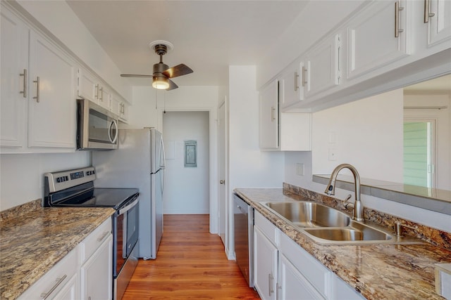 kitchen featuring white cabinetry, sink, ceiling fan, and appliances with stainless steel finishes