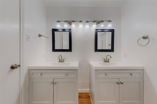 bathroom featuring vanity and hardwood / wood-style floors