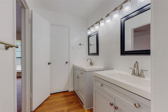 bathroom with vanity and hardwood / wood-style floors