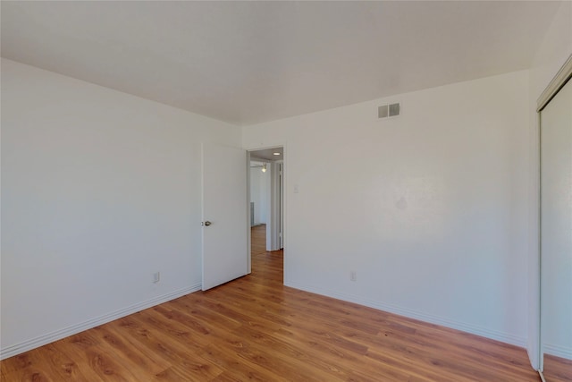 unfurnished room featuring light hardwood / wood-style floors