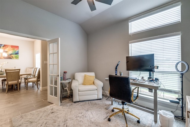 office space with ceiling fan, lofted ceiling, light wood-type flooring, and french doors