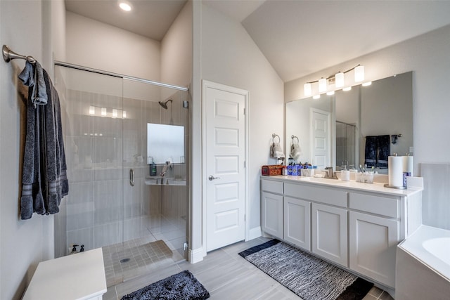 bathroom with vanity, tile patterned flooring, lofted ceiling, and separate shower and tub