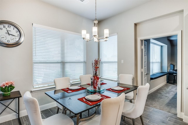 dining room featuring a chandelier