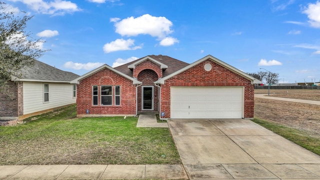 ranch-style home featuring a garage and a front yard