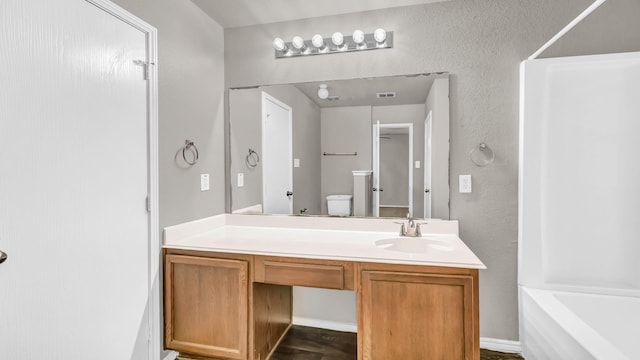 full bathroom featuring vanity, toilet, and shower / bathing tub combination