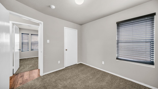 unfurnished bedroom with carpet