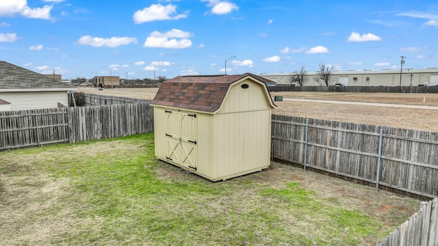 view of outbuilding featuring a lawn