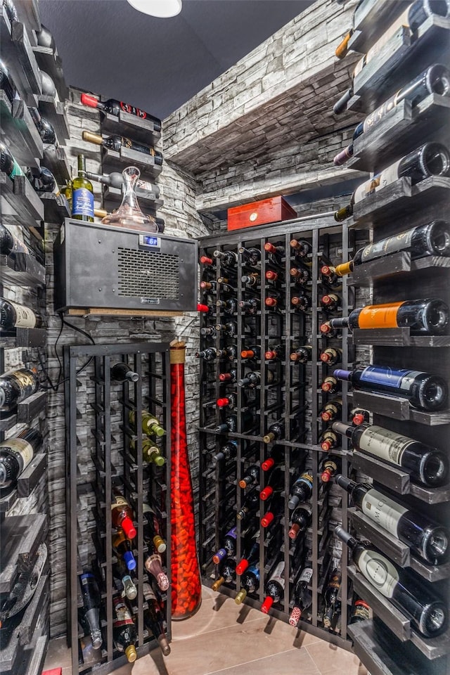 wine room with tile patterned flooring