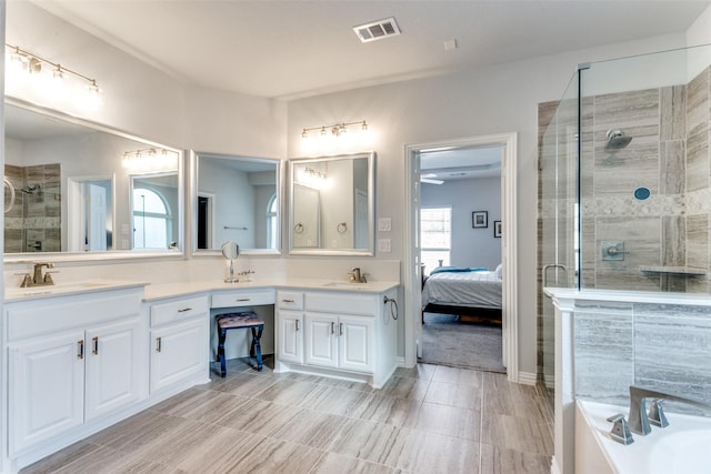 bathroom with double vanity, a sink, visible vents, and a shower stall