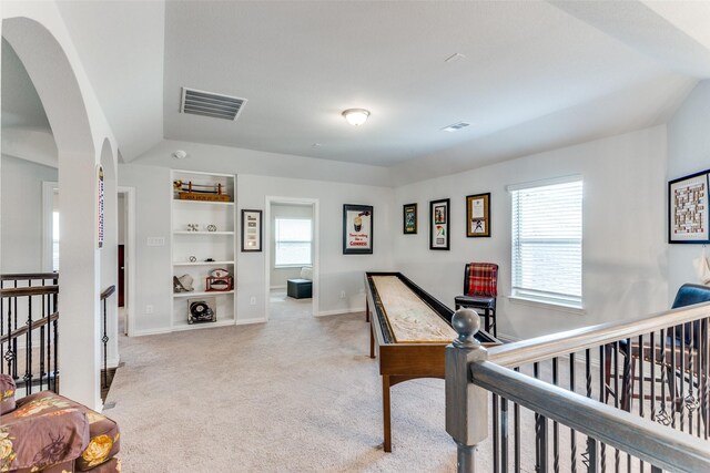 hallway with light carpet