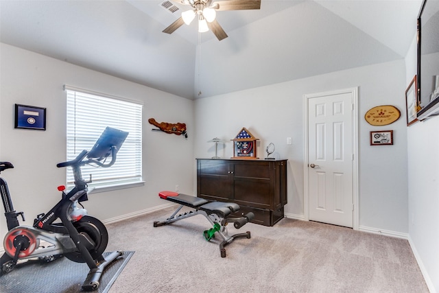 exercise room with lofted ceiling, baseboards, visible vents, and carpet