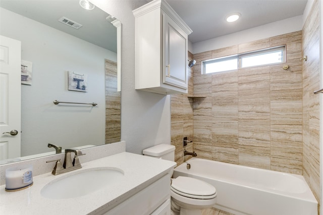 full bathroom with toilet, visible vents, shower / washtub combination, and vanity