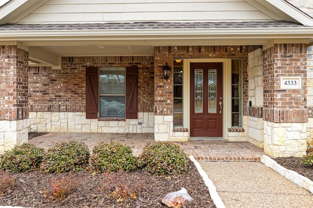 entrance to property featuring a porch