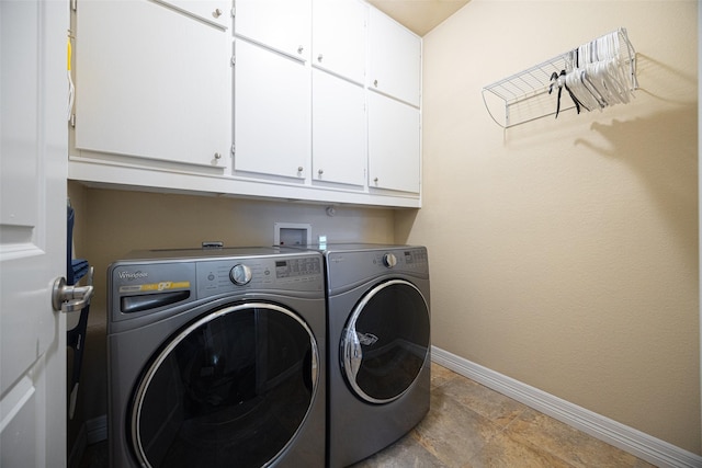 laundry area with cabinets and washer and dryer