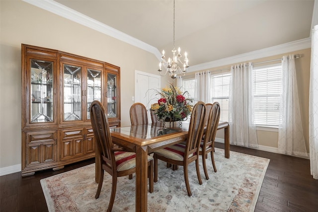 dining space featuring lofted ceiling, dark wood-type flooring, ornamental molding, and a chandelier