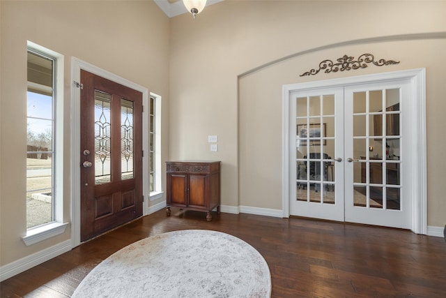 entryway with dark wood-type flooring, french doors, and a healthy amount of sunlight