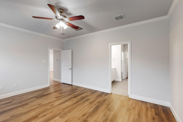 unfurnished bedroom featuring ceiling fan, ornamental molding, ensuite bath, and light wood-type flooring