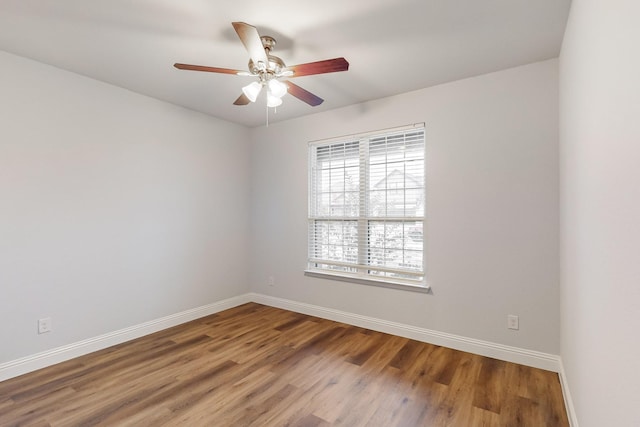 unfurnished room with ceiling fan and wood-type flooring