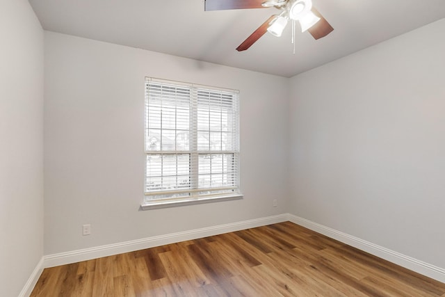 empty room featuring hardwood / wood-style floors and ceiling fan