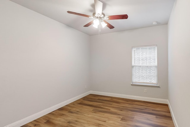 spare room featuring ceiling fan and wood-type flooring