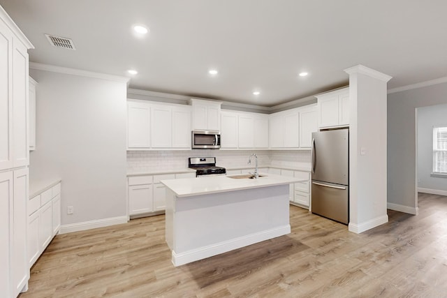 kitchen featuring white cabinetry, sink, crown molding, and appliances with stainless steel finishes