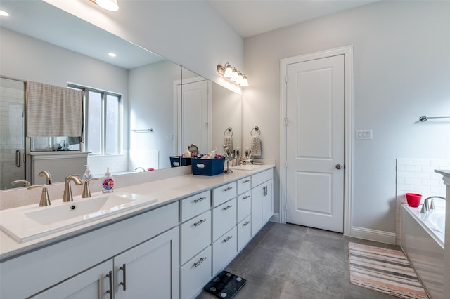 bathroom featuring vanity and separate shower and tub