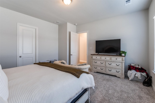 bedroom featuring light carpet