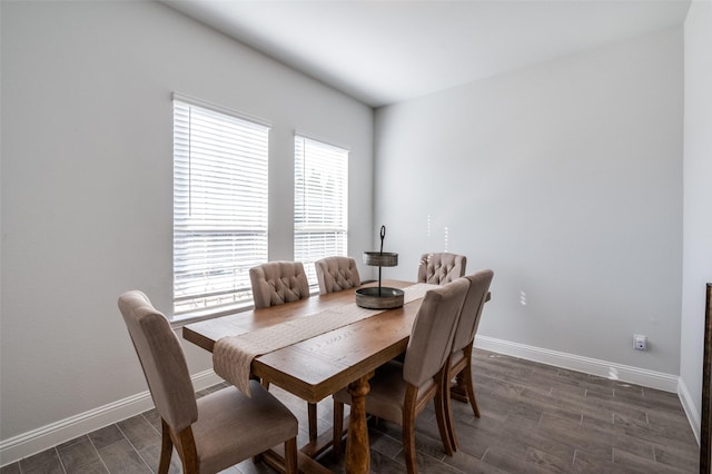 dining space featuring dark hardwood / wood-style flooring