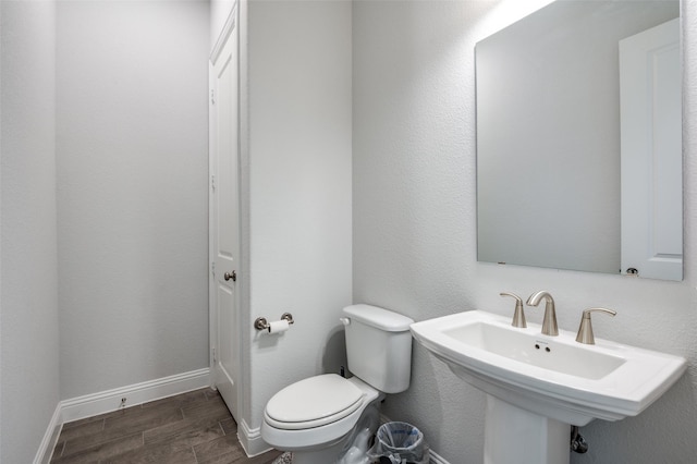 bathroom with toilet and sink