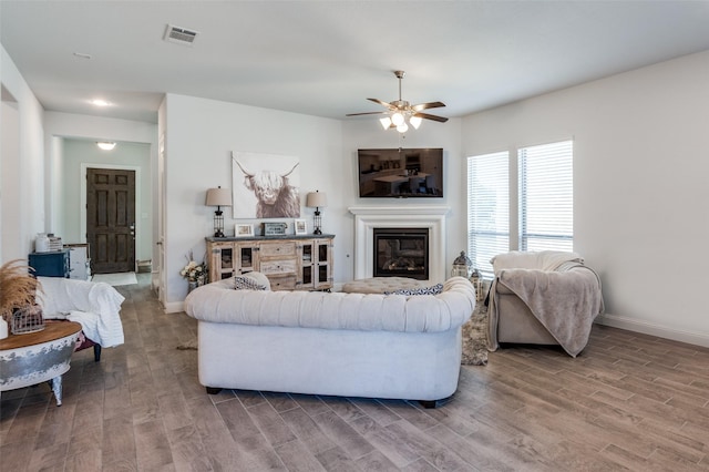 living room with hardwood / wood-style flooring and ceiling fan