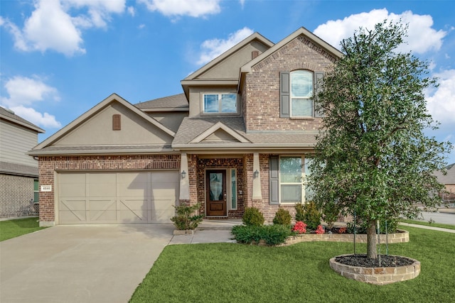 view of front of house featuring a garage and a front yard