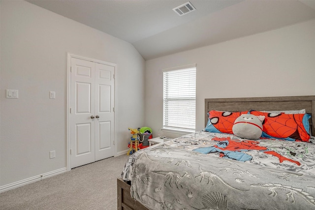 carpeted bedroom featuring vaulted ceiling