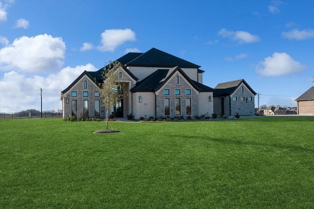 view of front of home with a front lawn