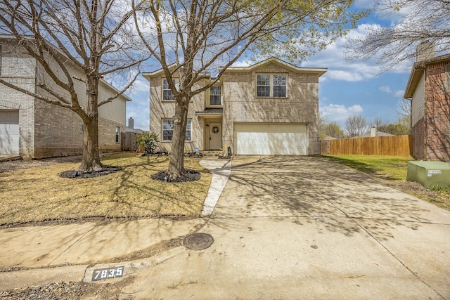 7935 Faithful Trl, Dallas, TX 75237 - traditional home featuring an attached garage, fence, and concrete driveway