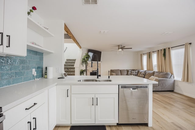7935 Faithful Trl, Dallas, TX 75237 - kitchen featuring stainless steel dishwasher, a peninsula, open shelves, a ceiling fan, and open floor plan
