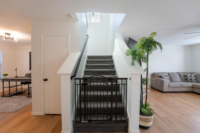 stairway featuring hardwood / wood-style flooring