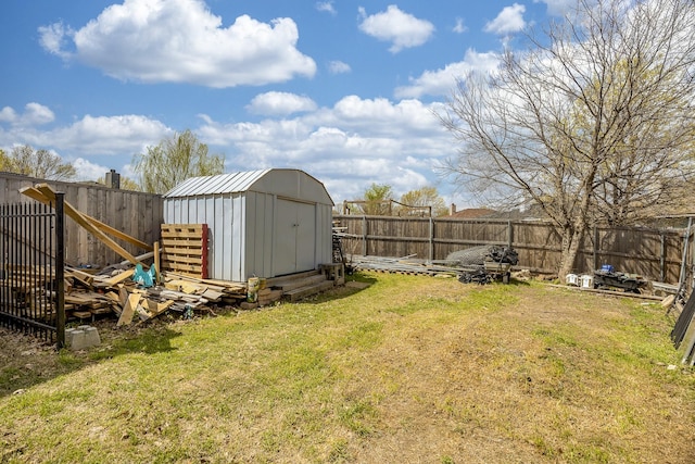 7935 Faithful Trl, Dallas, TX 75237 - view of yard with a fenced backyard, an outdoor structure, and a storage unit