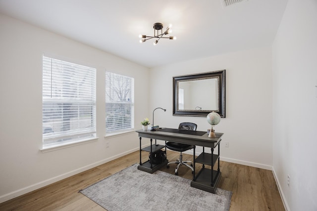 7935 Faithful Trl, Dallas, TX 75237 - office space with a notable chandelier, baseboards, and wood finished floors
