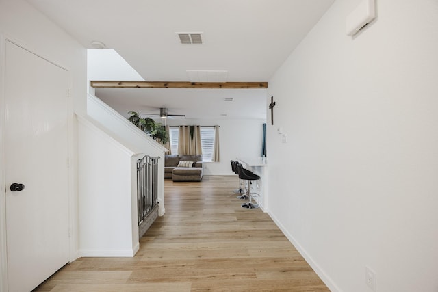 7935 Faithful Trl, Dallas, TX 75237 - hall featuring visible vents, baseboards, and light wood finished floors