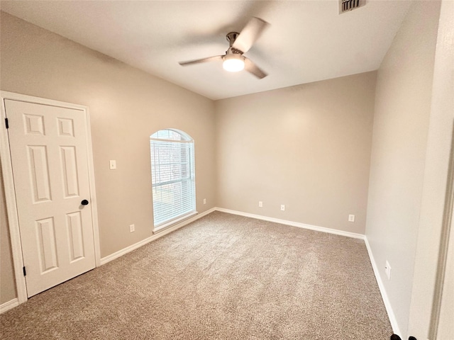 carpeted empty room with ceiling fan